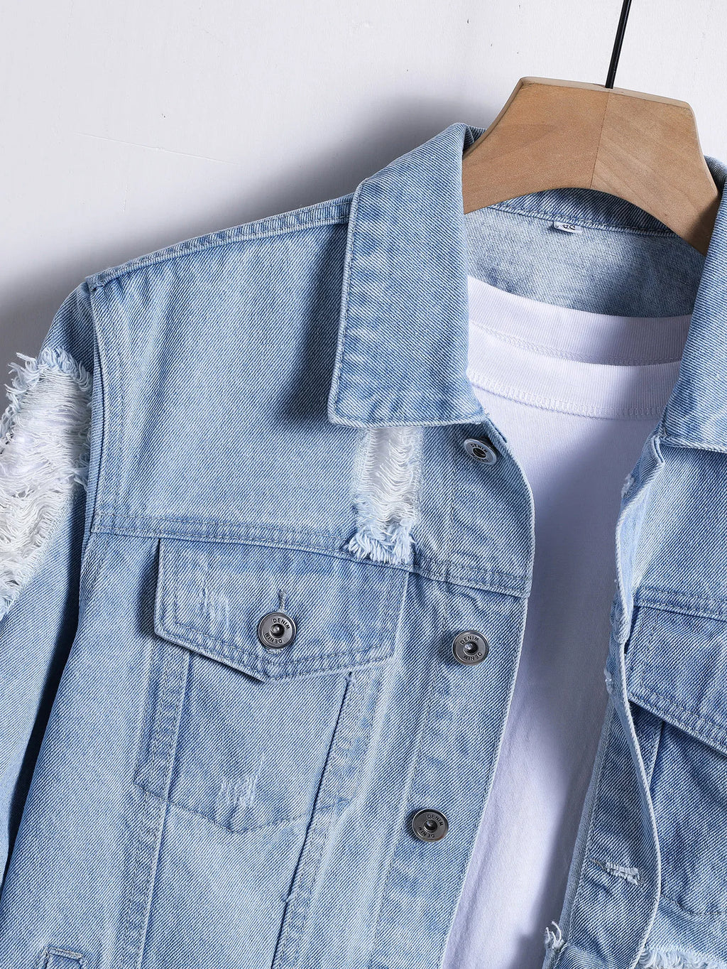 Light blue ripped denim jacket