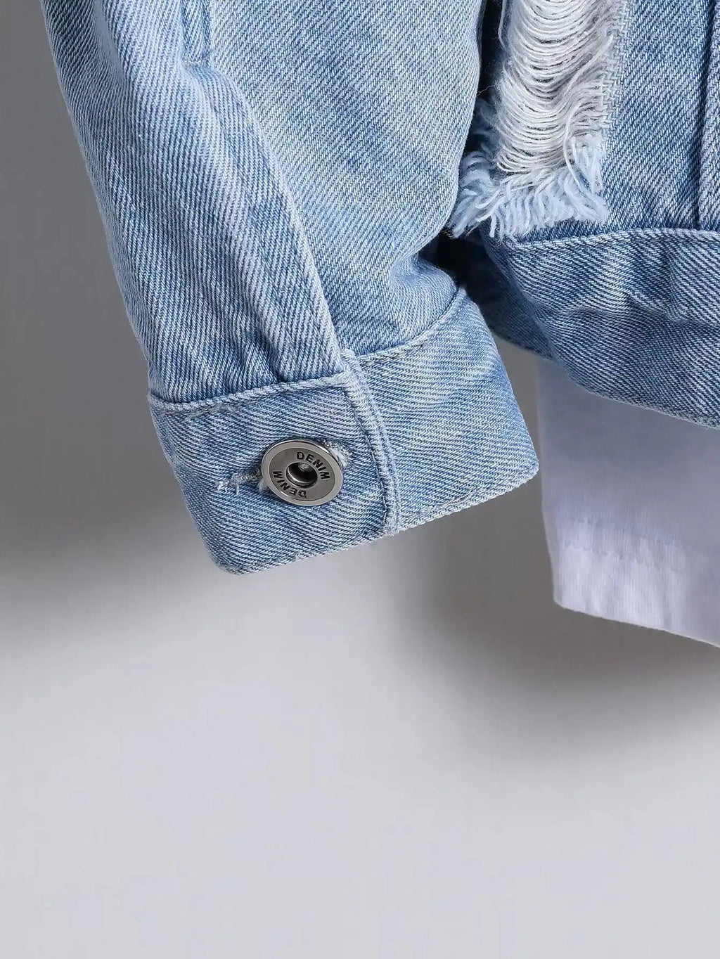 Light blue ripped denim jacket